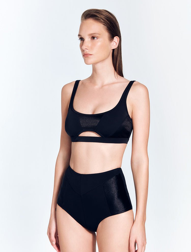 Front View: Model in Willow Black Bikini Top - MOEVA Luxury Swimwear, Underwired Top, Satin Matte Contrast, Adjustable Straps, MOEVA Luxury Swimwear