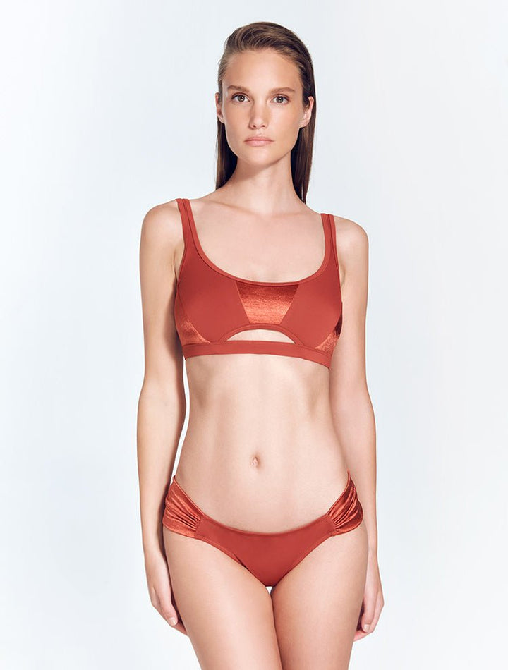 Front View: Model in Willow Red Ochre Bikini Top - MOEVA Luxury Swimwear, Underwired Top, Satin Matte Contrast, Adjustable Straps, MOEVA Luxury Swimwear