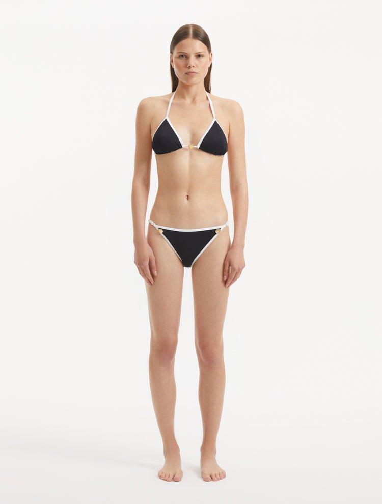 Front view of the Zarya Black Bikini Bottom, showcasing its low-rise cut and duo-colored design.