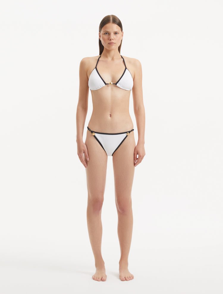 Front view of the Zarya White Bikini Top showcasing the elegant triangle design and duo-colored hues.