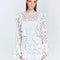 Zhen White Lace Midi Dress with Ruffle Detail | Moeva | Beachwear Dresses | Each week unveils new pieces—luxury swimwear, fluid resort silhouettes, and elevated summer-to-evening essentials designed to carry you from coastal escapes to city nights.