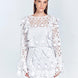 Zhen White Lace Midi Dress with Ruffle Detail | Moeva | Beachwear Dresses | Each week unveils new pieces—luxury swimwear, fluid resort silhouettes, and elevated summer-to-evening essentials designed to carry you from coastal escapes to city nights.